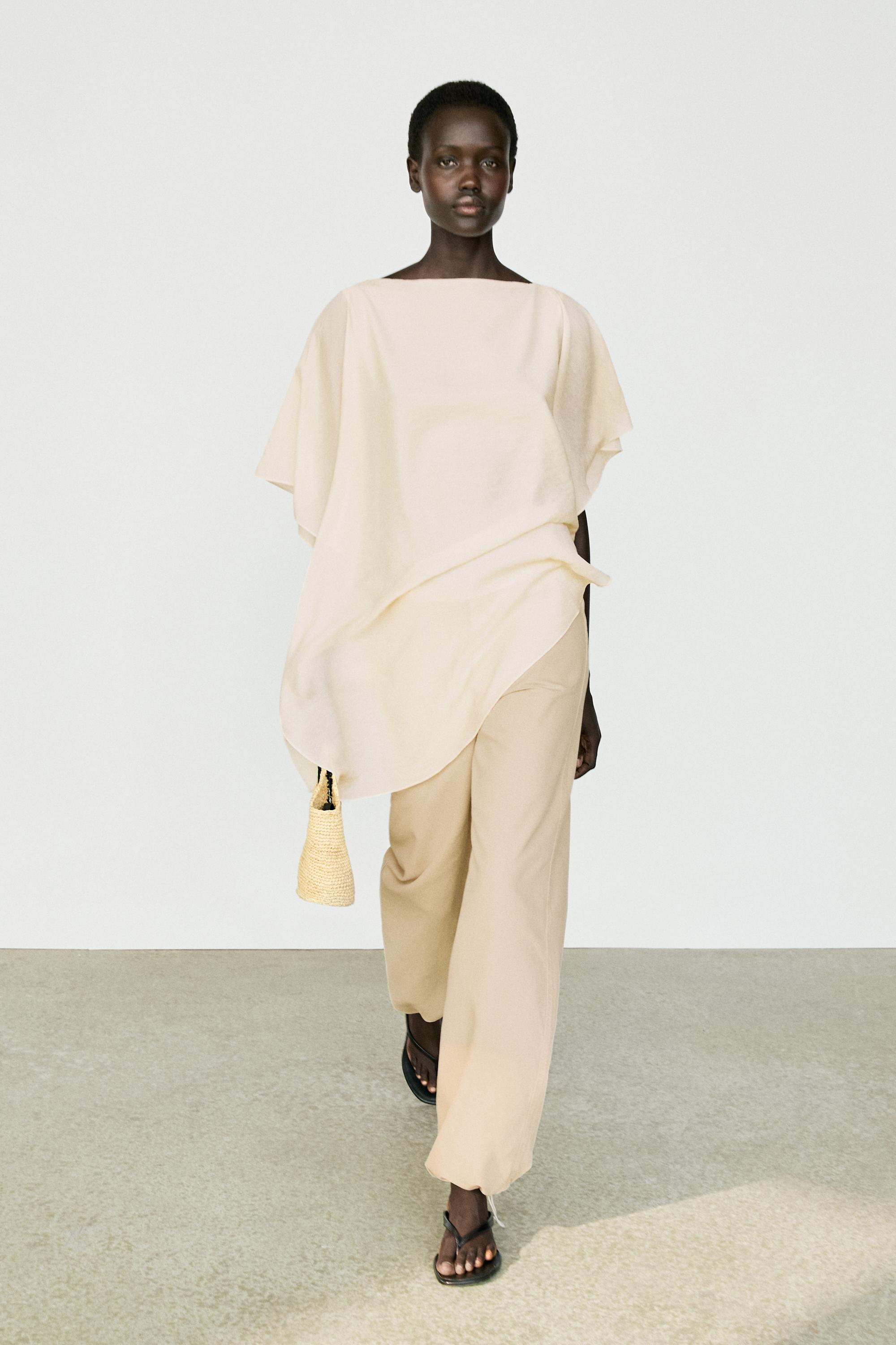 Blouse fluide asymétrique style cape
